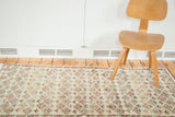 Distressed Oushak runner with faded sea foam green, blush floral, and serpent medallion border.