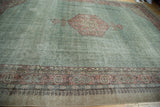 Distressed Oushak carpet, blush diamond herati medallion, faded slate green field.