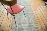Distressed teal green Oushak runner detail with sand and bronze geometric floral border.
