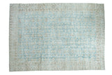 Distressed Oushak carpet featuring faded aqua blue field and muted floral vase pattern, 8'10