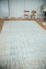 Distressed Oushak rug with faded aqua green/blue field and allover softened patterns.