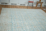 Distressed character with faded aqua green and light wooded tones, Oushak carpet.