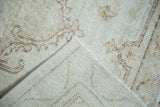 Distressed Oushak runner pile, hand-knotted foundation, and secured side edge.