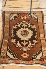 Intricate floral medallion and corner spandrel with tangerine orange on vintage Oushak rug.