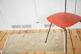 Soft sandy beige tones and subtle tone-on-tone minimalist pattern of this Oushak rug.