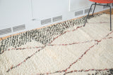 Plush ivory Moroccan Berber rug pile with playful wine red and speckled charcoal lines.