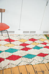 Plush, hand-knotted vintage Moroccan rug pile, with red, yellow, and teal argyle diamonds.