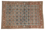 Vintage Persian Veramin rug, allover Mina Khani florals, striated blue field, rust border with birds.