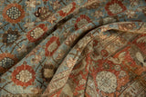 Vintage Veramin carpet's Mina Khani design, abrashes, and textural folds in blues, faded rust, and wooded tones.