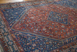Intricate Qashqai geometric patterns, Laleh Abassi pawn motif on vintage Shiraz rug.