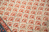Distressed ivory Malayer rug field, with madder root red blossoming flower patterns.