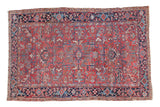 Vintage hand-knotted Persian Heriz rug with brick red geometric medallion and dark blue border, 6'1