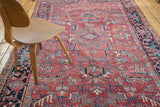 Vintage hand-knotted Heriz carpet with geometric field in brick red, navy, and teal.