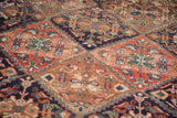 Distressed Afshar rug displaying terra cotta and green tribal floral patterns within serrated panels.