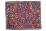 Hand-knotted Northwest Persian rug with geometric floral medallion in cherry red and navy blue.