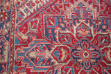 Hand-knotted geometric floral renderings in saturated cherry red and navy blue.