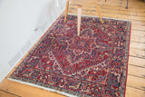 Vintage Northwest Persian rug with cherry red gerus arabesque border and navy geometric details.