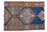 Antique Northwest Persian rug: distressed indigo, rust, and coppery geometric Herati design, 3'4