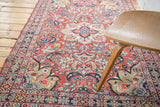 Vintage Arak Sarouk rug's cherry red field, featuring expressive vines and unique lime green florals.