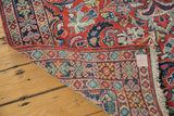 Vintage Arak Sarouk rug corner folded, showing full pile, woven reverse, and fringe.