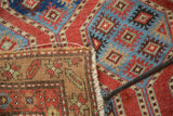 Hand-knotted foundation, geometric motif, and tattered selvage of antique Northwest Persian rug.