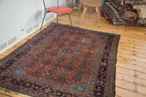 Distressed Malayer rug with brick red Herati field and dark blue double samovar border.
