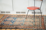 Vintage Malayer rug, oversize paisley boteh and blue field abrash, with madder border.