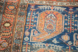 Vintage Malayer rug: Navy field, softened madder root border, and bold paisley boteh motif.