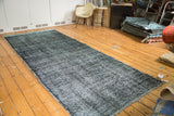 Faded dark blue and grey overdyed texture of the vintage Sparta gallery runner, with fringe detail.