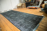 Vintage Turkish Overdyed gallery runner, dark with acid wash distress and light blue fringe.