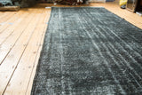 Vintage Overdyed Sparta runner showing dark grey and faded white acid wash texture.