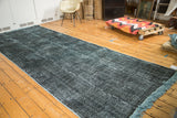 Distressed vintage Turkish gallery runner with acid-wash effect in deep teal and pale grey.
