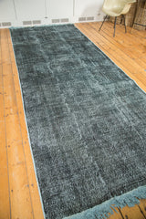 Distressed overdyed dark teal pile with contrasting light blue fringe.
