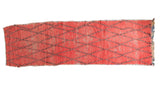 Distressed vintage Moroccan runner, hand knotted with faded cinnabar red and navy lattice.