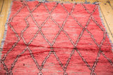 Vintage Moroccan runner with rag rug texture and faded cinnabar red diamond lattice.