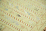 Lime green Moroccan kilim corner: striped patterns, geometric serpent motifs in terra cotta, teal.