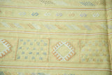 Lime green Moroccan kilim with embroidered serpent motifs, geometric guls, and stripes.