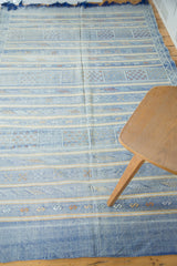 Finely woven blue Moroccan Kilim detail showing serpent motifs and geometric floral guls.