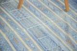 Finely woven sky blue kilim with geometric floral guls and serpent motifs.