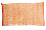 Burnt orange Moroccan Kilim rug, finely woven with geometric striped patterns in ivory, blue, and gold.