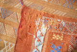 Burnt orange Moroccan Kilim rug edge, finely woven with geometric guls and serpent motifs.