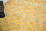 Finely woven saffron yellow kilim with embroidered geometric guls and stripes.