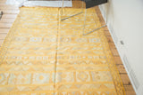 Saffron yellow Moroccan kilim featuring finely woven geometric embellishments and serpent motifs.