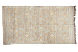 Moroccan Kilim rug, finely woven with subtle eggplant purple, geometric stripes, and serpent motifs.