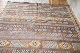 Finely woven Moroccan kilim, geometric stripes with serpent and gul motifs in ivory, gold, silver.