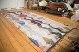 Vintage Moroccan rag rug runner, an abstract argyle motif with mixed color patchwork.
