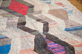 Colorful rag strips with varied texture in a Moroccan argyle diamond pattern.