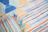 Dense, colorful horizontal stripes of vintage Moroccan rag rug's recycled textile weave.