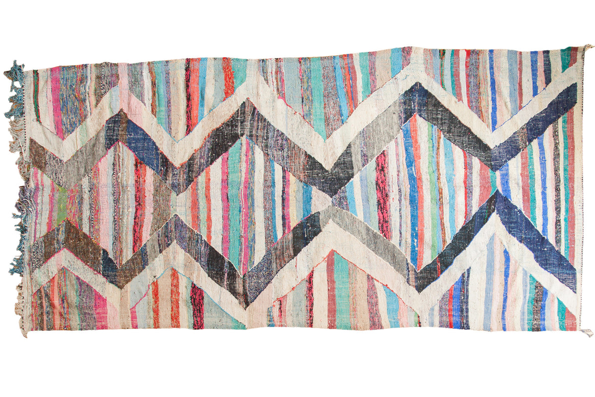Handwoven Vintage Rag Rug Runner with ivory and charcoal chevron zigzags over vibrant striped field.