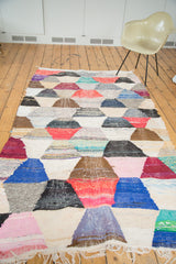 Varied recycled cotton textile texture and hexagonal motif of the vintage rag rug.